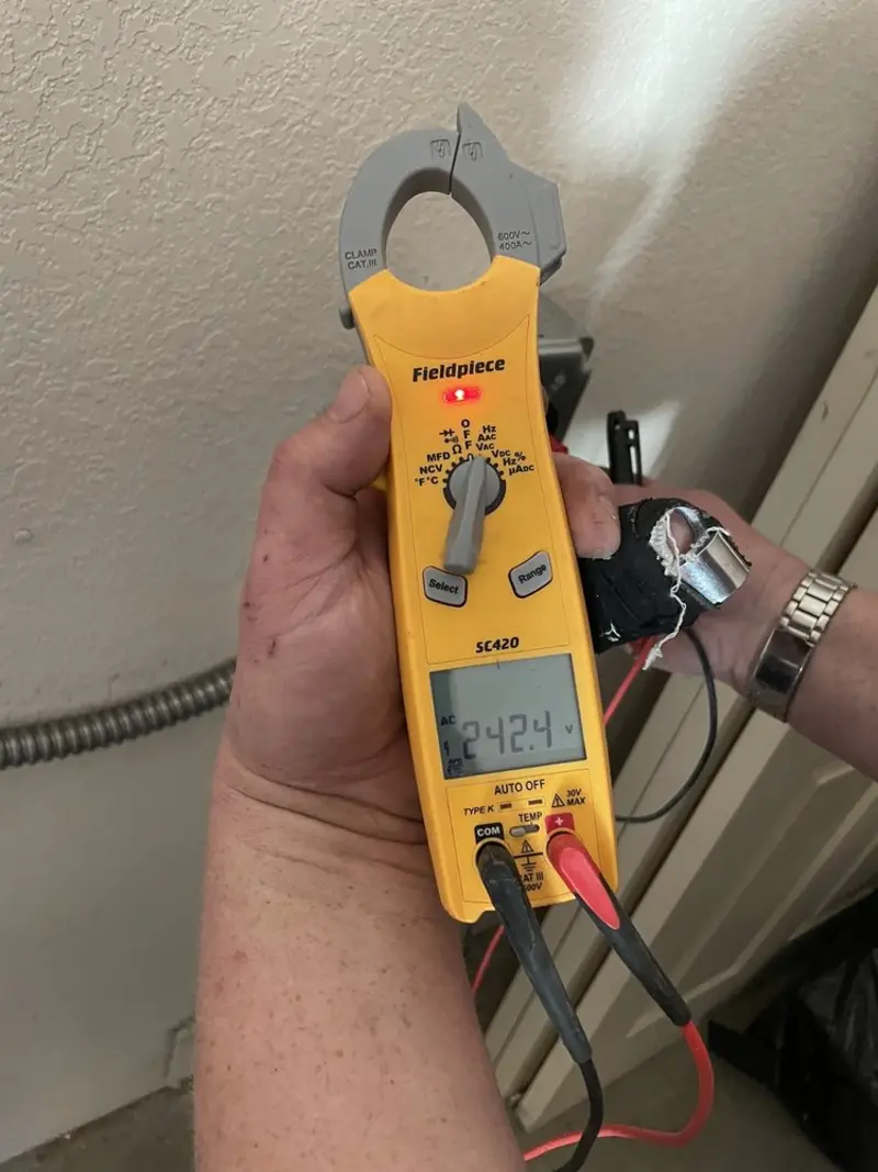 Voltage testing with clamp meter during Generator Installation in Richmond